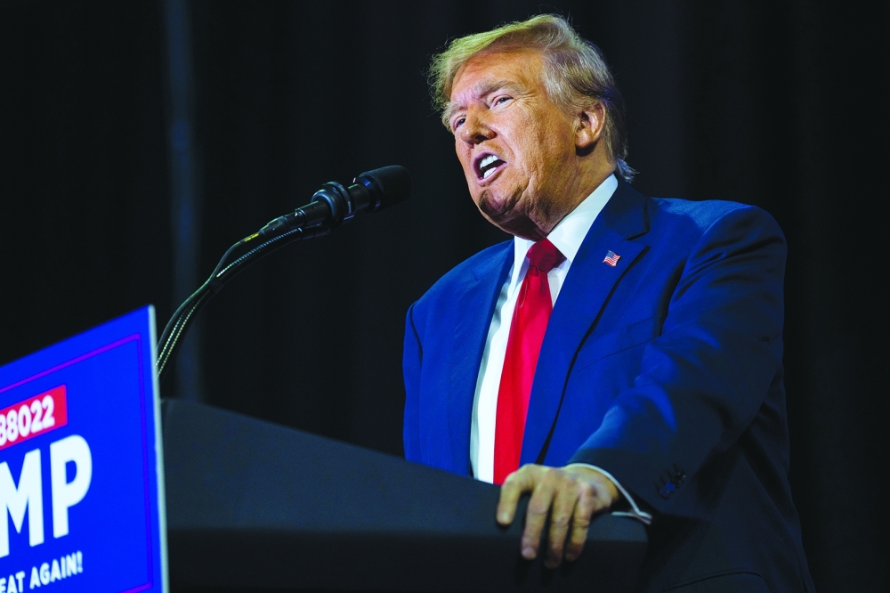 Former President Donald Trump on stage during a campaign rally in Manchester.