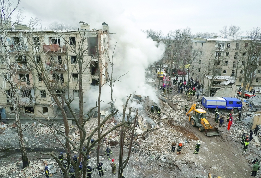Rescuers work at a site of a residential building heavily damaged during a Russian missile attack, in Kharkiv, Ukraine. — Reuters