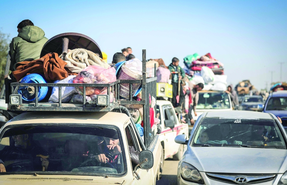 This photograph on the southern outskirts of Khan Yunis shows Palestinian families fleeing the city on the coastal road leading to Rafah. — AFP