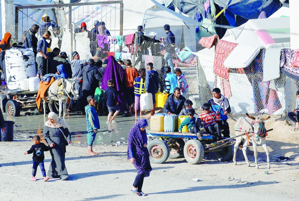 Displaced Palestinians, who fled their houses due to Israeli strikes, shelter at a tent camp, in Rafah. — Reuters