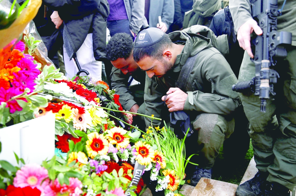 Friends and family mourn Israeli military reservist Sergeant Major Matan Lazar, at his funeral, in Haifa. — Reuters