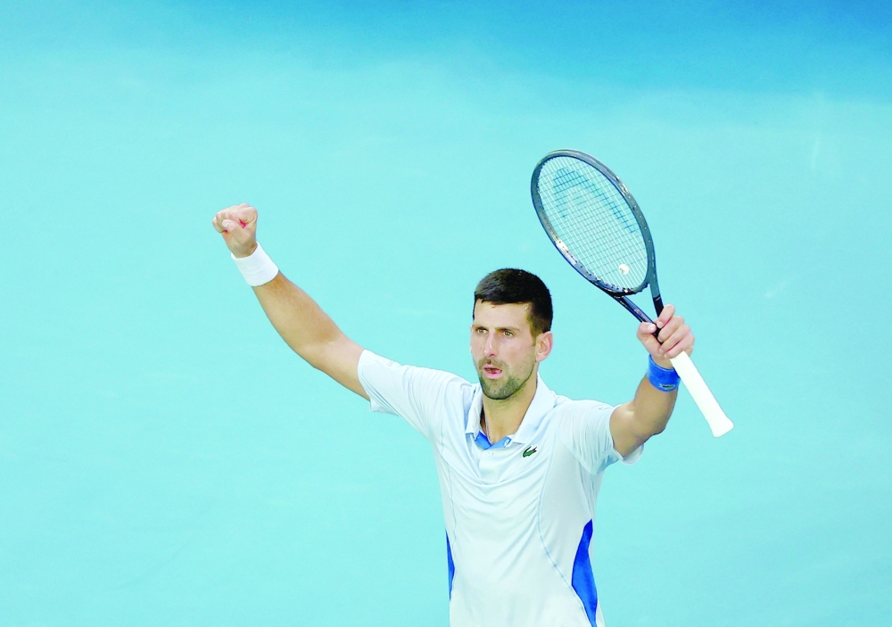 Tennis - Australian Open - Melbourne Park, Melbourne, Australia - January 23, 2024 Serbia's Novak Djokovic celebrates after winning his quarter final match against Taylor Fritz of the US REUTERS/Edgar Su