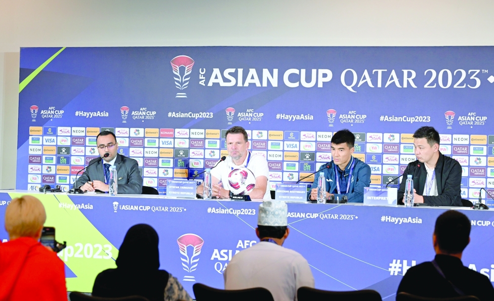Kyrgyzstan head coach attends a press conference. -- Hussain al Muqbali