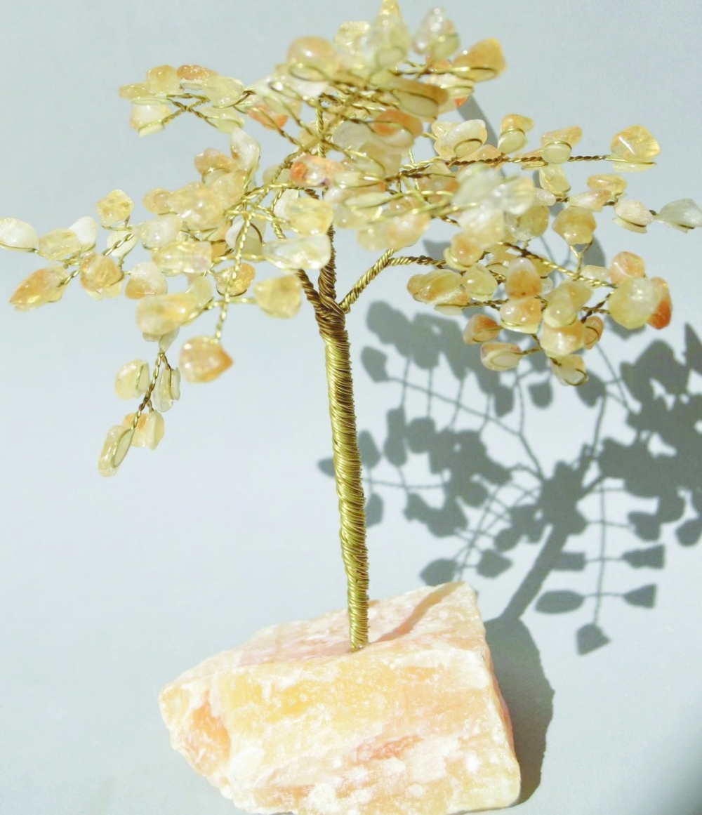 A tree crafted from citrine crystals, embodying both the golden glow of the gemstone
