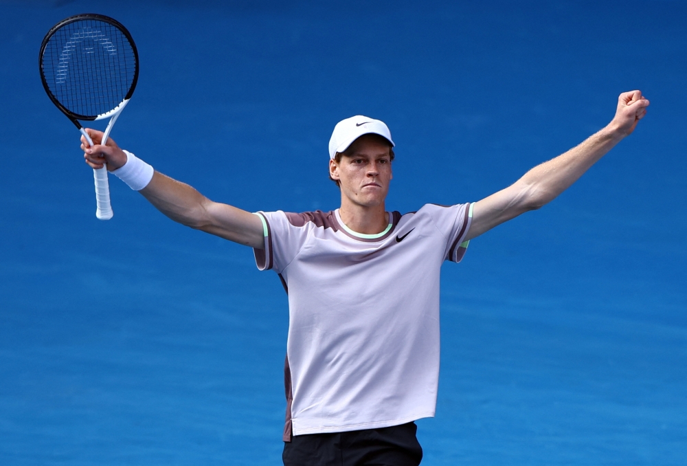 Tennis - Australian Open - Melbourne Park, Melbourne, Australia - January 26, 2024 Italy's Jannik Sinner celebrates winning his semifinal match against Serbia's Novak Djokovic 