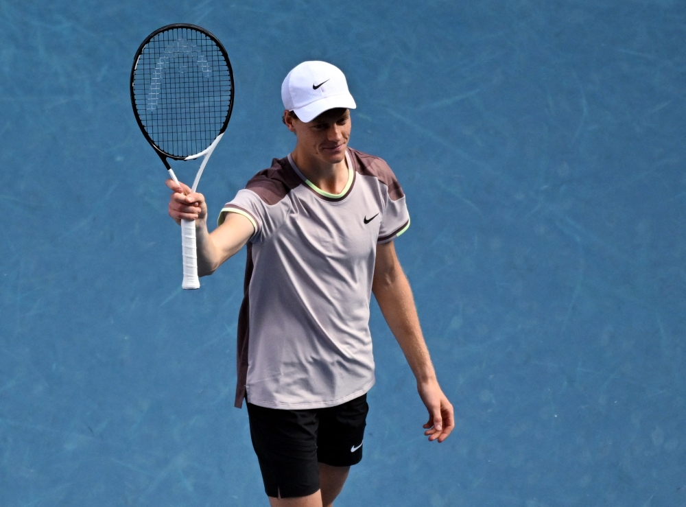 Tennis - Australian Open - Melbourne Park, Melbourne, Australia - January 26, 2024 Italy's Jannik Sinner celebrates winning his semifinal match against Serbia's Novak Djokovic 