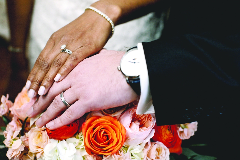 A newly married couple display their wedding rings in O’Fallon, Mo., Jan. 16 2021. 