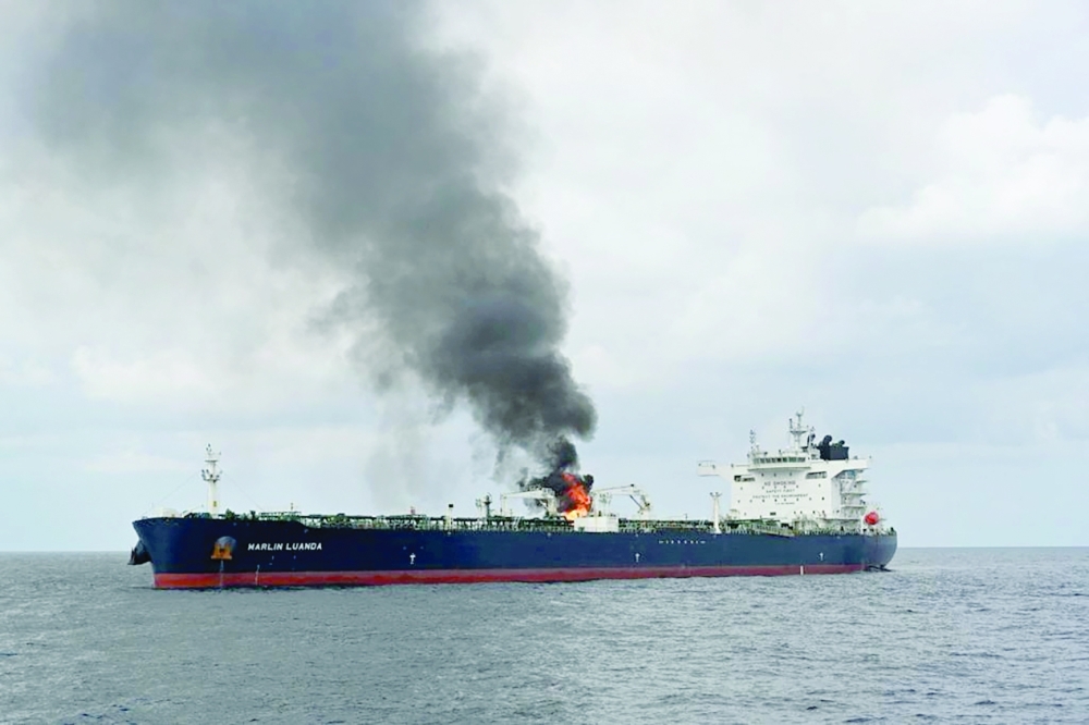 Smoke rises from Marlin Luanda, merchant vessel, after the vessel was struck by an anti-ship missile, at the location given as Gulf of Aden. — Reuters 