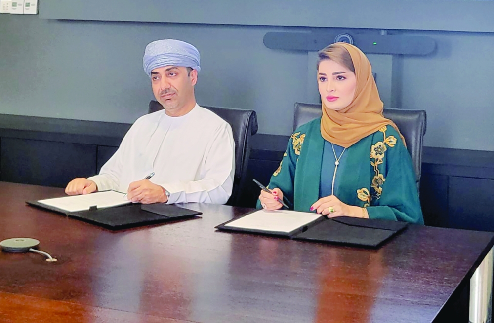 Mazin bin Mahmood al Raisi and Maisa al Hooti signed the agreement