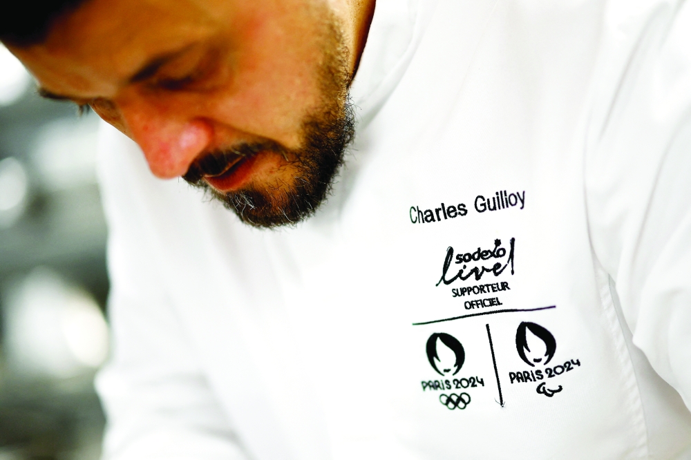 The executive chef for the Paris 2024 Olympic Games, Charles Guilloy, prepares a dish that will be served to athletes competing in the Paris 2024 Olympics and Paralympics, in Rungis, near Paris, France January 26, 2024. REUTERS/Sarah Meyssonnier