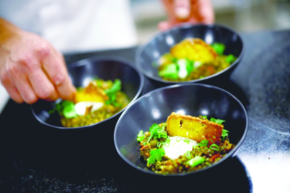 The executive chef for the Paris 2024 Olympic Games, Charles Guilloy, prepares a dish that will be served to athletes competing in the Paris 2024 Olympics and Paralympics, in Rungis, near Paris, France January 26, 2024. REUTERS/Sarah Meyssonnier
