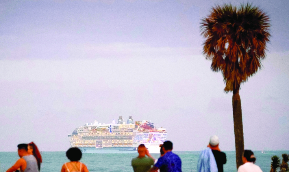 TOPSHOT - People watch as Royal Caribbean's "Icon of the Seas," billed as the world痴 largest cruise ship, sails from the Port of Miami in Miami, Florida, on its maiden cruise, January 27, 2024. 