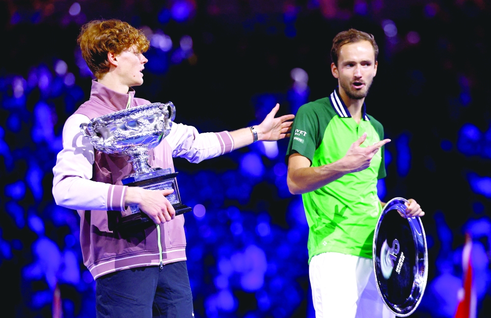 Italy's Jannik Sinner with the trophy after winning the final alongside runner up Russia's Daniil Medvedev.— REUTERS
