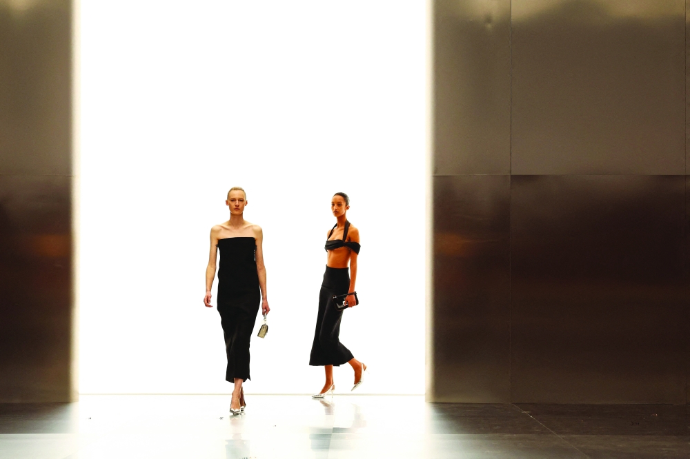 Models present creations by Fendi during the Women's Haute-Couture Spring/Summer 2024 show as part of the Paris Fashion Week at the Palais Brongniart in Paris, on January 25, 2024.