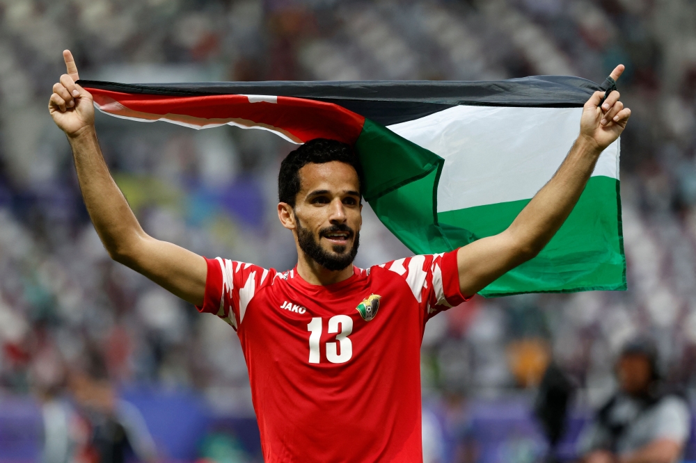 Jordan's midfielder Mahmoud Al Mardi celebrates his team's win in the Qatar 2023 AFC Asian Cup football match against Iraq