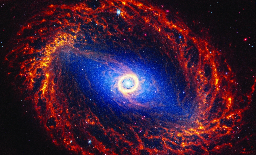 Spiral galaxy NGC 1512, located 30 million light-years away from Earth, is seen in an undated image from the James Webb Space Telescope. 