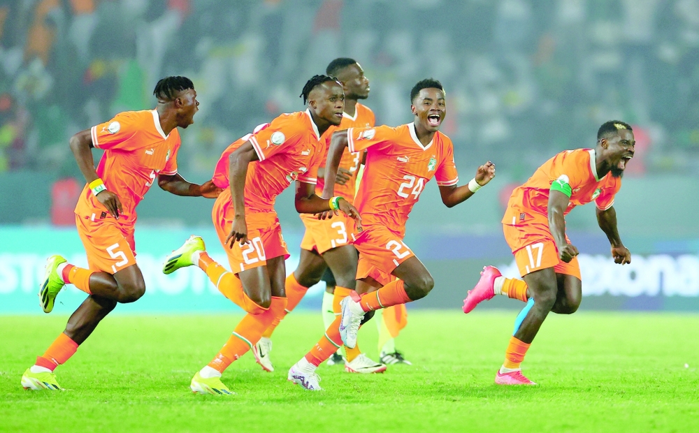 Africa Cup of Nations - Round of 16 - Senegal v Ivory Coast - Charles Konan Banny Stadium, Yamoussoukro, Ivory Coast - January 29, 2024  Ivory Coast players celebrate after winning the penalty shoot-out.