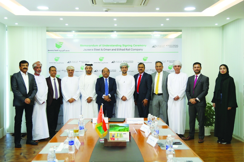 Officials of Oman-Etihad Rail and Al Jazeera Steel Products signing the MoU.