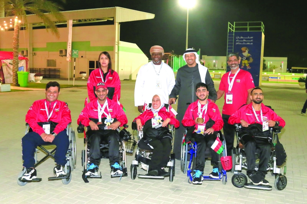 The Oman wheelchair basketball team with officials.
