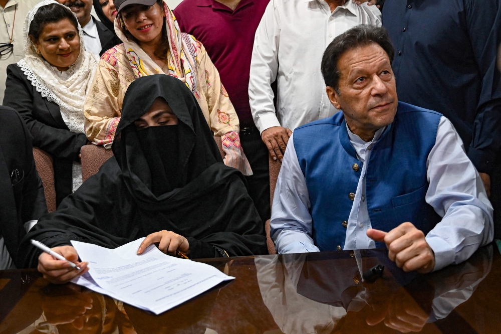 Former Pakistan Prime Minister Imran Khan with his wife Bushra Bibi 