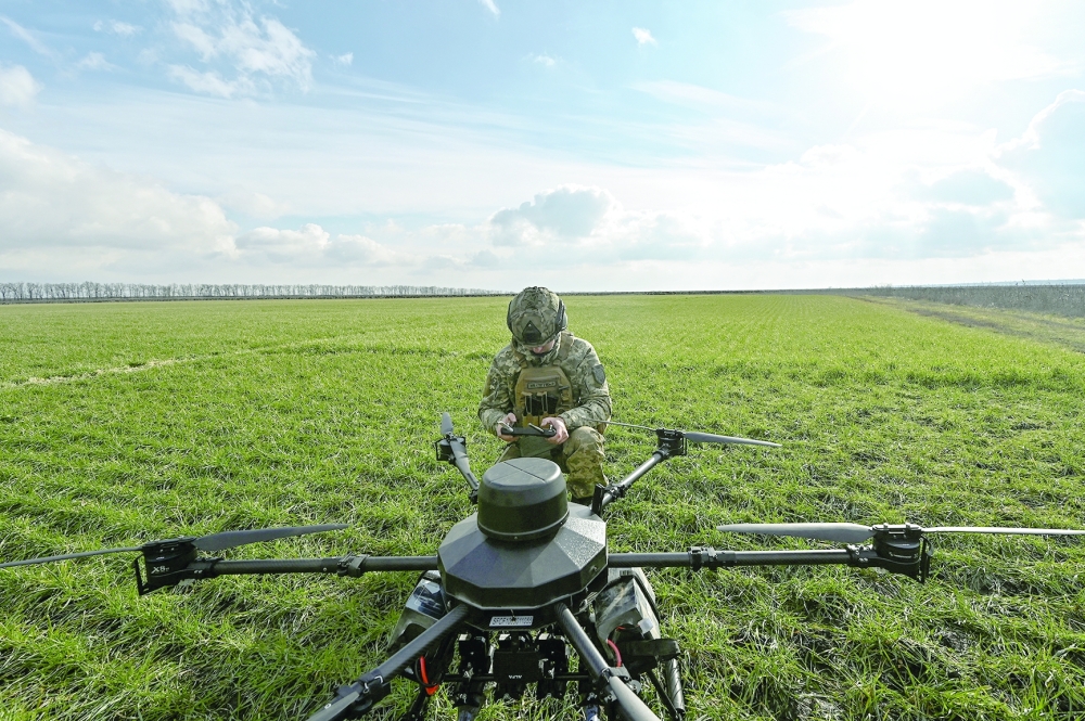 A Ukrainian serviceman checks a connection with a Vampire unmanned aerial vehicle (UAV) before flying near a front line, in Zaporizhzhia region, Ukraine. — Reuters 