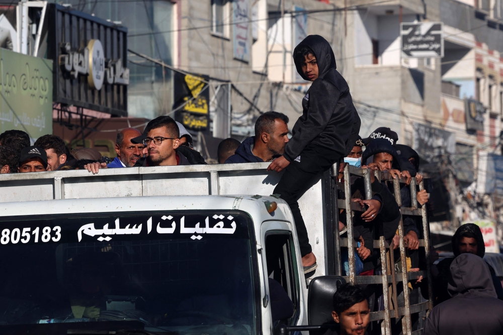 Displaced Palestinians use a truck as a means of transportation in Rafah in the southern Gaza Strip. — AFP 