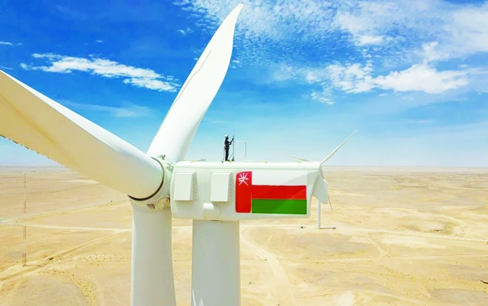 A wind turbine technician is seen on top of a wind turbine in Oman, in this illustration photo.