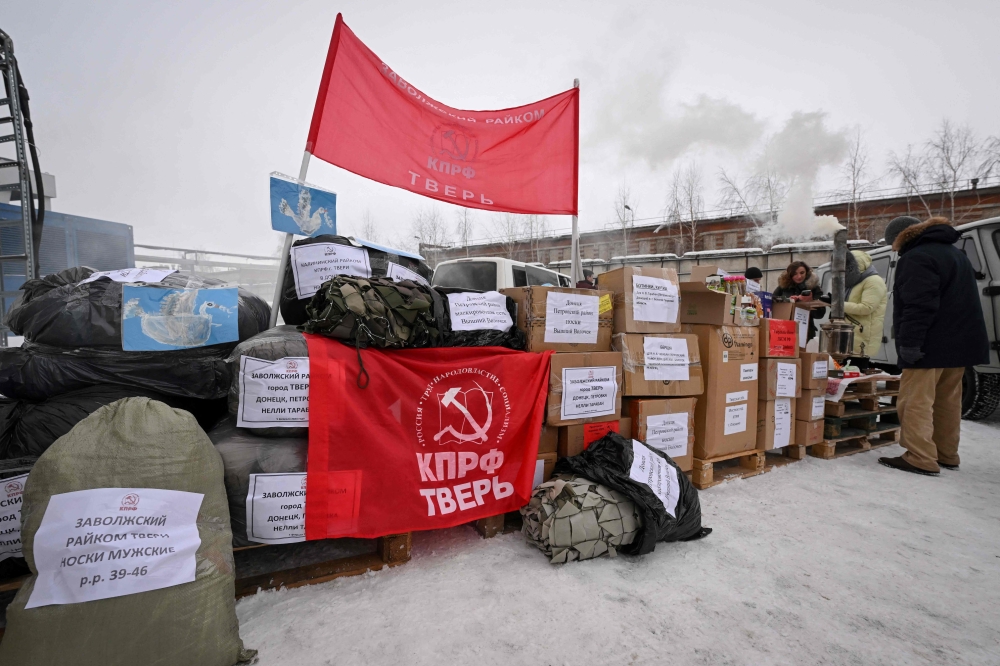 Russian Communist party activists send off a convoy of humanitarian aid to Russia's troops participating in the country's military action in Ukraine, in the Moscow region. — AFP 