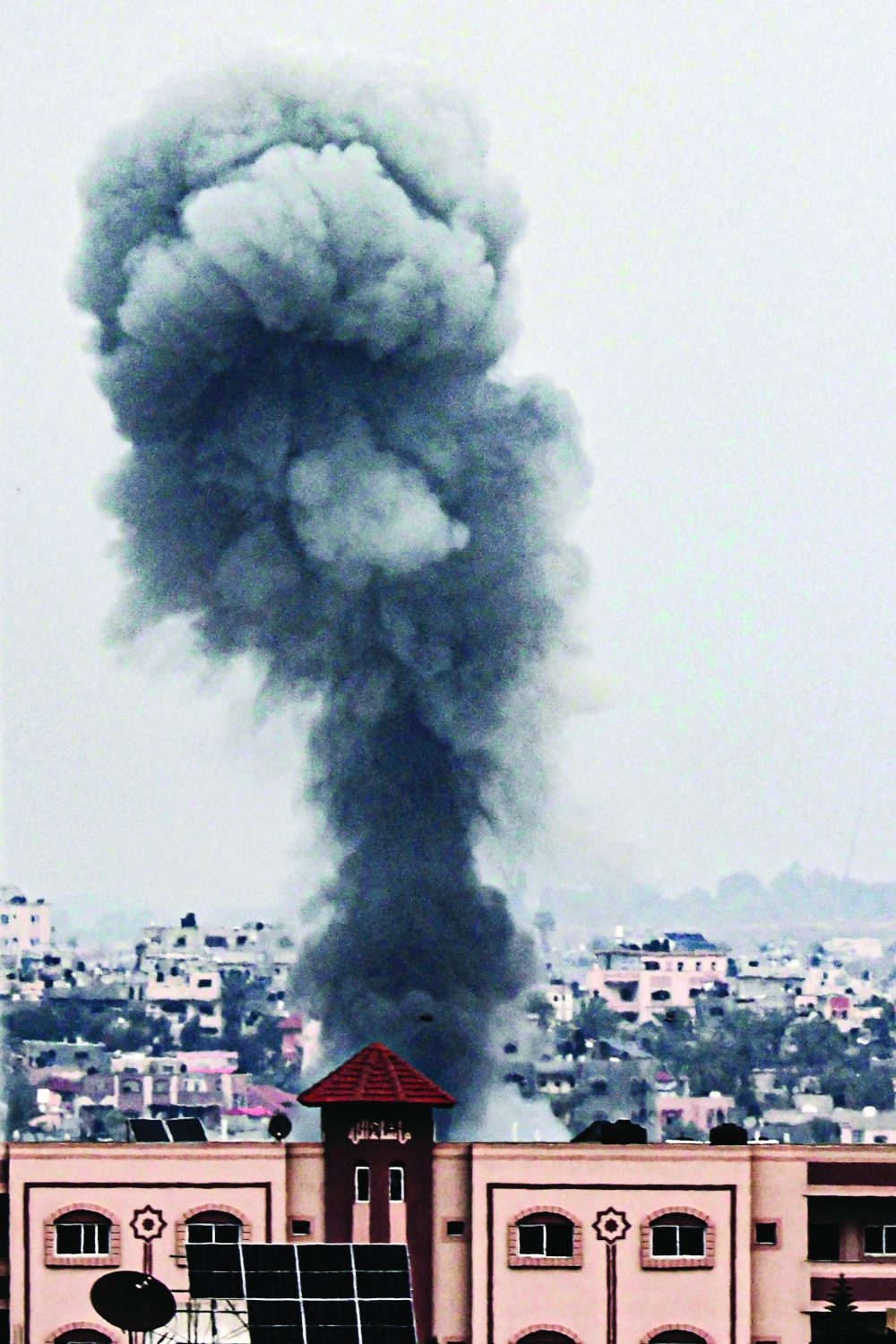 A picture shows smoke rising over buildings in Khan Younis following Israeli bombardment. — AFP