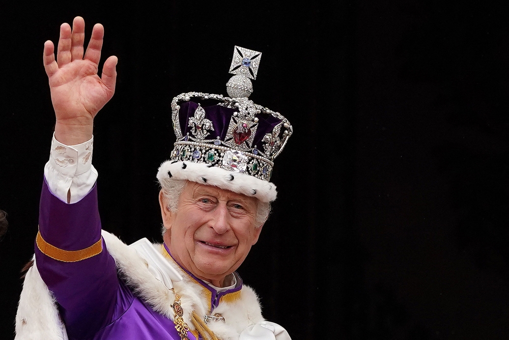 Britain's King Charles III wearing the Imperial state Crown, waves from the Buckingham Palace balcony 
