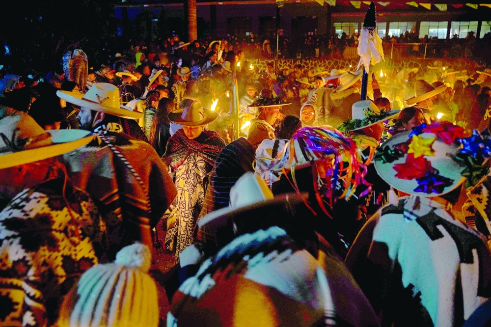 Purepecha痴 Indigenous community members light wooden sticks during a ceremony in Ocumicho indigenous village, Michoacan State, Mexico, on February 1, 2024. Every year, Purepecha痴 Indigenous people from different regions of Michoacan State celebrate the Fuego Nuevo Purepecha (Purepecha痴 New Fire), a fire lighting ceremony to mark the start of the new year.