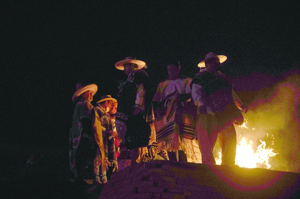 Purepecha痴 Indigenous community members light wooden sticks during a ceremony in Ocumicho indigenous village, Michoacan State, Mexico, on February 1, 2024. Every year, Purepecha痴 Indigenous people from different regions of Michoacan State celebrate the Fuego Nuevo Purepecha (Purepecha痴 New Fire), a fire lighting ceremony to mark the start of the new year.