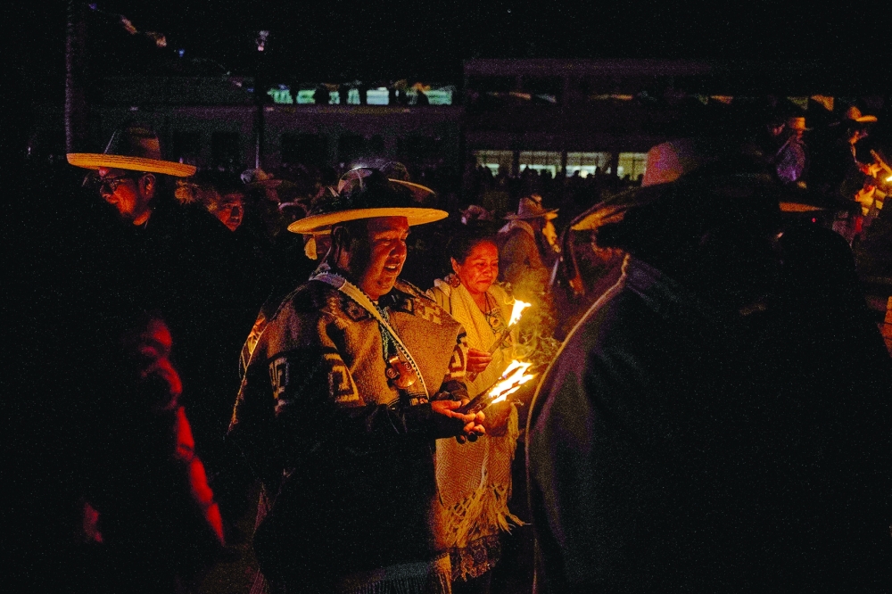 Purepecha痴 Indigenous community members light wooden sticks during a ceremony in Ocumicho indigenous village, Michoacan State, Mexico, on February 1, 2024. Every year, Purepecha痴 Indigenous people from different regions of Michoacan State celebrate the Fuego Nuevo Purepecha (Purepecha痴 New Fire), a fire lighting ceremony to mark the start of the new year.