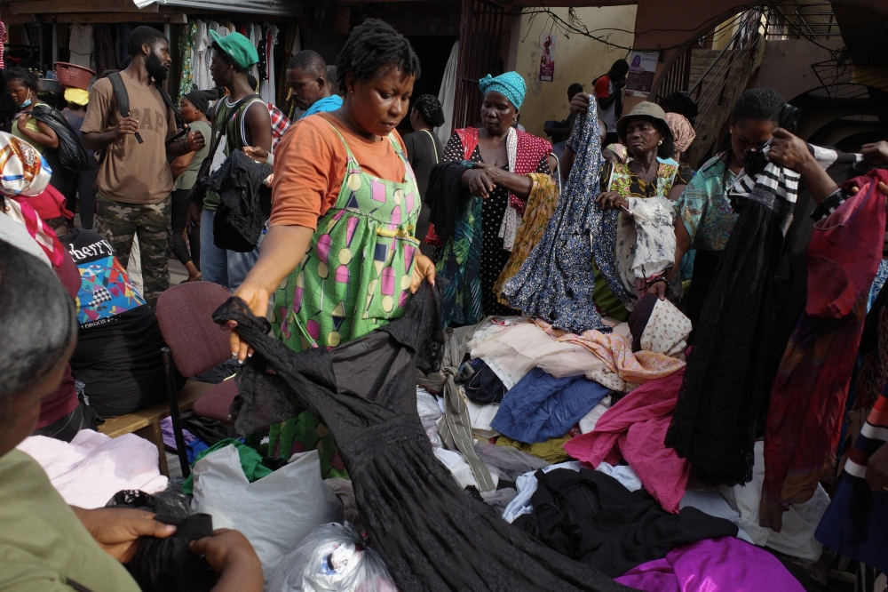 People go through secondhand clothes at the Kantamanto market in Accra
