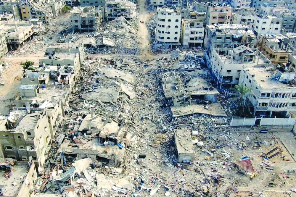 An aerial view shows destroyed buildings in Beit Lahia following Israeli bombardments in the northern Gaza. — AFP