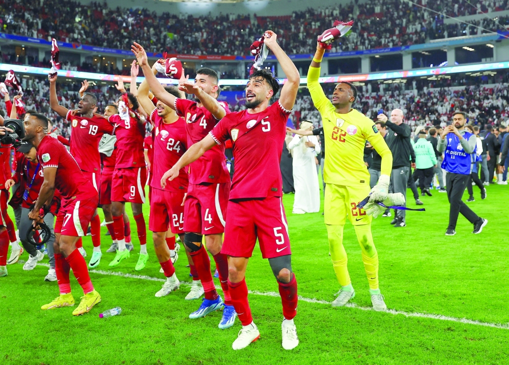 AFC Asian Cup - Semi Final - Iran v Qatar - Al Thumama Stadium, Doha, Qatar - February 7, 2024 Qatar players celebrate after reaching the AFC Asian Cup final.