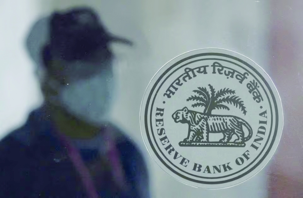 A man walks past the RBI logo at its Mumbai headquarters. — Reuters