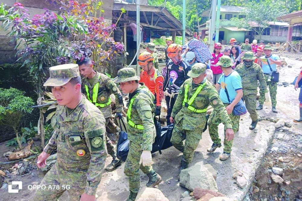 Members of the army partake in rescue operations following a landslide on Mindanao island, in the village of Maco, Davao de Oro province. - Reuters