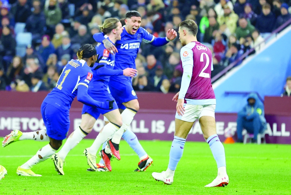 Chelsea's Conor Gallagher celebrates scoring their first goal with Enzo Fernandez and Noni Madueke. REUTERS