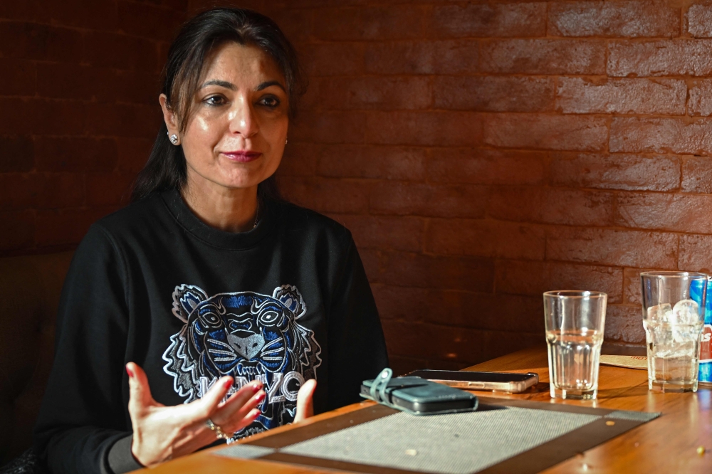  Rubina Kapoor, a jewellery designer, speaks during an interview with AFP while dining at the Moti Mahal restaurant 