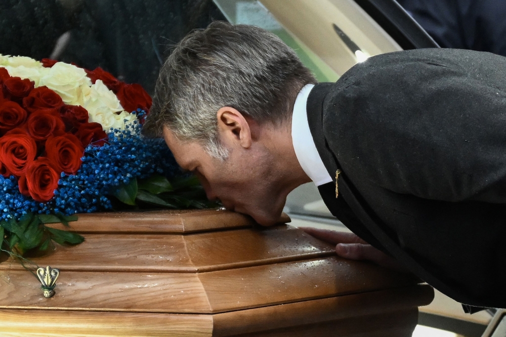 TOPSHOT - Prince Emanuele Filiberto of Savoy kisses the coffin of his father, late Prince Vittorio Emanuele of Savoy, following his funeral ceremony at the Duomo cathedral in Turin on February 10, 2024.
 Prince Vittorio Emanuele of Savoy, son of Italy's last king and member of a dynasty discredited for collaborating with fascism, died in Switzerland on February 3, 2024 at 86.

