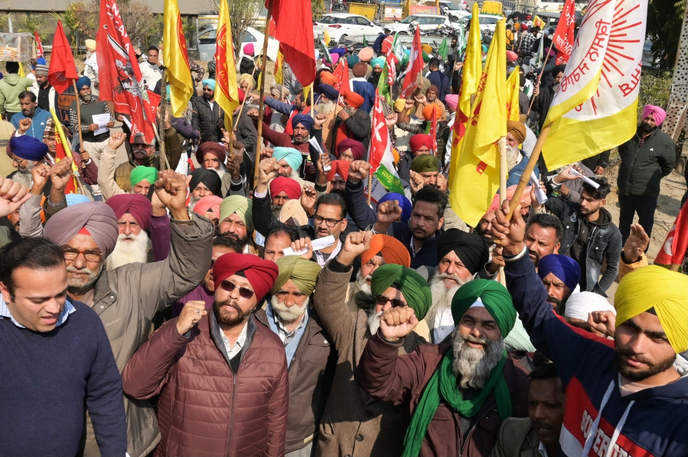 Farmers shout slogans during a protest demanding minimum crop prices in Amritsar, India. — AFP 