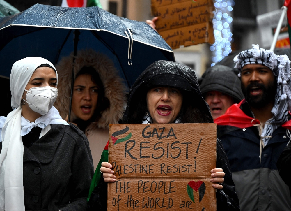 Demonstrators  take part in a rally in support of Palestinians, in central Rome. — AFP 