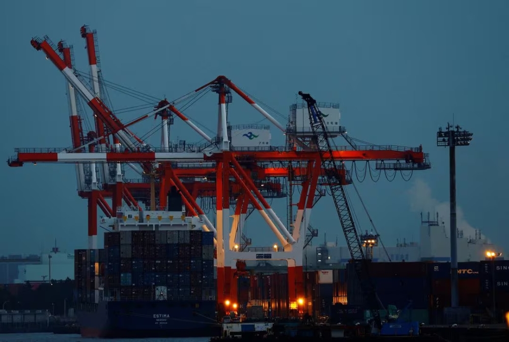 Cargo ship and containers at Tokyo port. — Reuters