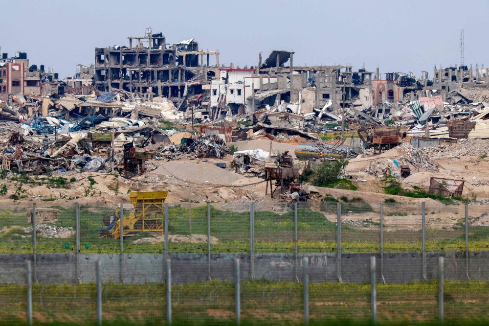 A picture taken from a position in southern Israel destroyed buildings in the Gaza Strip amid ongoing battles between Israel and Hamas