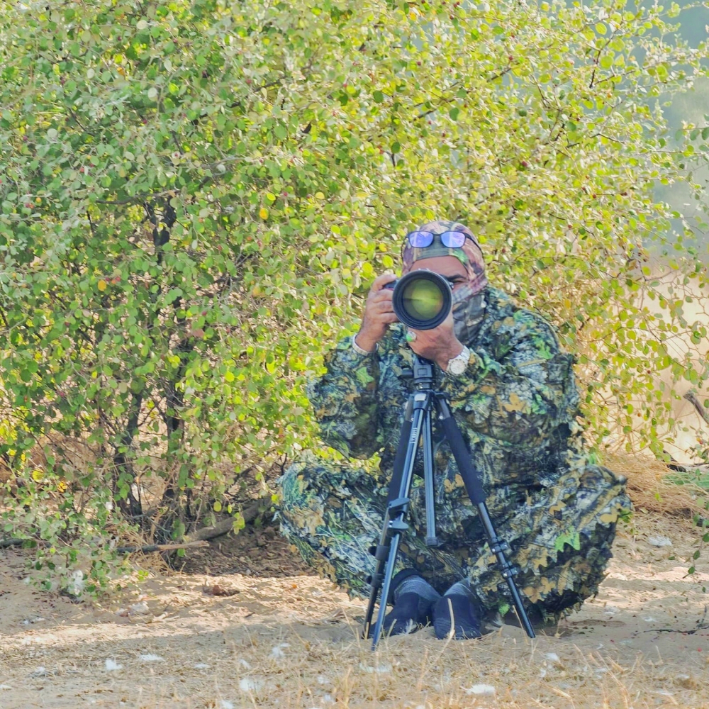 Nasser bin Hamed al Harthy at work with his camera
