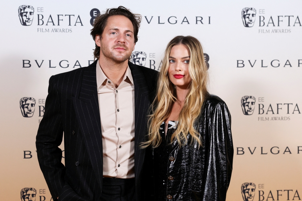 Margot Robbie and her husband Tom Ackerley pose at the Nominees Party for 2024 BAFTA Film Awards, supported by Bulgari, at the National Gallery in London, Britain, February 17, 2024. REUTERS/Isabel Infantes
