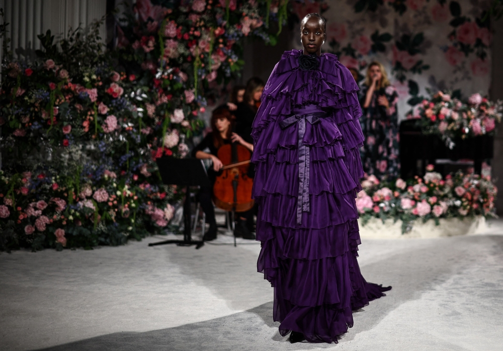 A model presents a creation by British designer Richard Quinn during the catwalk presentation for his Autumn/Winter 2024 collection during London Fashion Week in London on February 17, 2024. (Photo by HENRY NICHOLLS / AFP)

