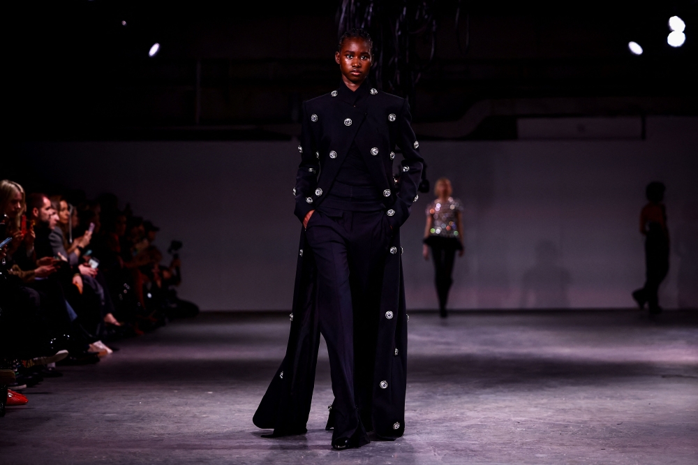 A model presents a creation by Georgian designer David Koma  during a catwalk presentation for his Autumn/Winter 2024 collection during London Fashion Week in London on February 17, 2024. (Photo by HENRY NICHOLLS / AFP)

