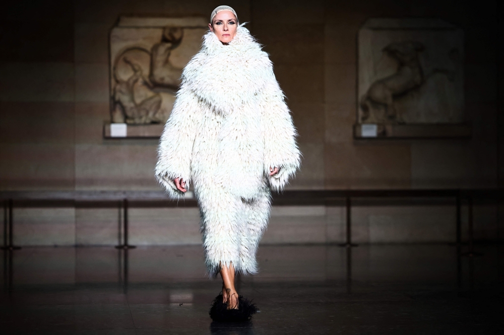 A model presents creation for Erdem during a catwalk presentation for their Autumn/Winter 2024 collection during London Fashion Week in London on February 17, 2024. (Photo by HENRY NICHOLLS / AFP)

